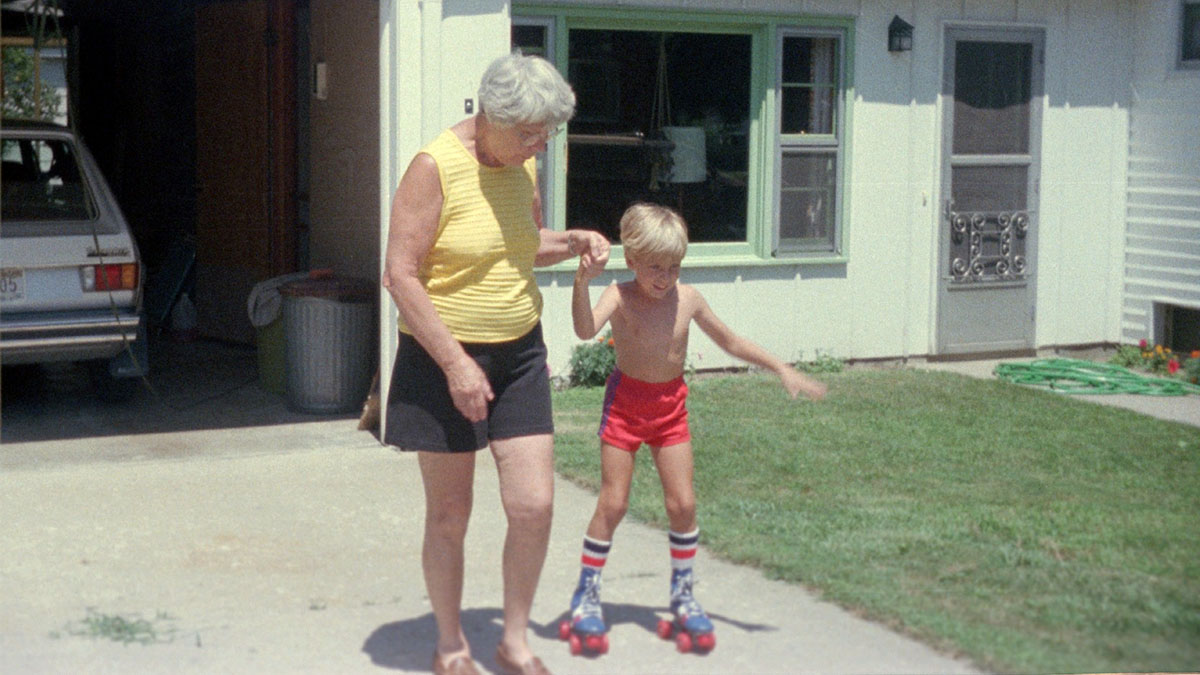 Young Max learning to skate with the help from his grandmother